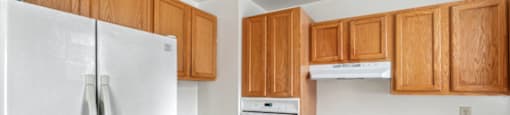 Kitchen with white appliances and wooden cabinets at Monterey Place, Connecticut
