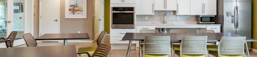Community room with tables and chairs at Station Pointe Apartments, Mansfield, MA, 02048