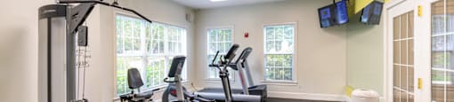 Fitness center with cardio and weights at Woodlands at Abington Station Apartments, Massachusetts, 2351