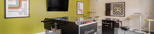 A games room with a pool table and a television at Station Pointe Apartments, Mansfield, MA, 02048