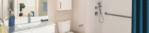a bathroom with a shower toilet and sink and a mirror at Beverly Village for Living & the Arts Apartments, Beverly, 01915