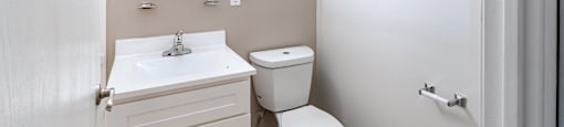 a bathroom with a toilet and a sink at Whittier Terrace, Worcester, MA, 01609