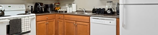 Kitchen with White Appliances  With Brown Cabinets at Greene Hills Estates, Springfield, 22153