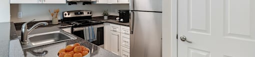 A kitchen with a sink, microwave, oven, and refrigerator A kitchen with wooden cabinets and stainless steel appliances at Pondside at Littleton Apartments in Littleton, MA, 01460