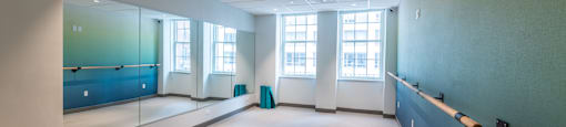 a large room with a large window and a blue wall  at 140 Clarendon, Boston, MA, 02116