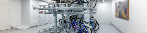 a group of bikes on a rack in a room  at 140 Clarendon, Boston, MA