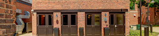 the front of a brick building with three doors at Ninth Square Apartments, New Haven, CT