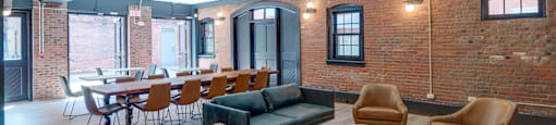 Community room with table and chairs at Ninth Square Apartments. at Ninth Square Apartments, New Haven
