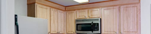 Stainless Steel With Light Wood Cabinets at Pondside at Littleton Apartments. at Pondside at Littleton, Littleton, MA