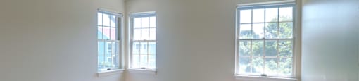 Carpeted Bedroom With Windows at Pondside at Littleton Apartments. at Pondside at Littleton, Littleton, MA
