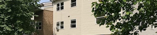 a yard in front of an apartment building