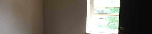 Bedroom with Window at Union City Apartments