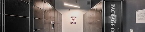 a hallway with black lockers and a welcome sign at Ninth Square Apartments, New Haven, CT, 06510