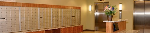 a large lobby with a counter and lockers and a door at Tai Tung Village, Massachusetts