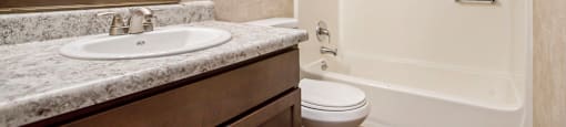 a bathroom with a sink toilet and bathtub