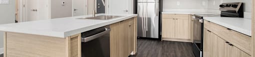 A kitchen with wooden cabinets and a white countertop.