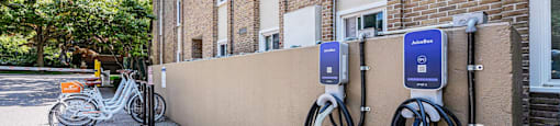 an electric bike parked outside of a charging station