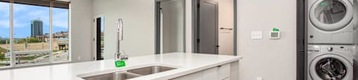 234 Market Apartments In Grand Rapids, MI With Renovated Kitchens featuring a quartz countertop island
