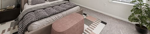 a bedroom with a bed and a ceiling fan