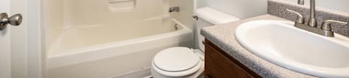 a bathroom with a sink toilet and bathtub