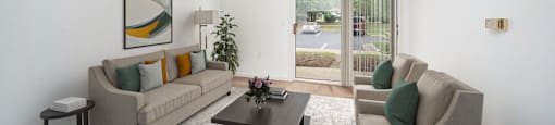 a living room with couches and a coffee table
