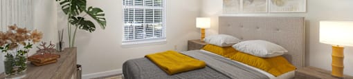 a bedroom with a bed and a dresser and a window