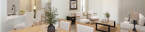 A dining room with a table set for four.