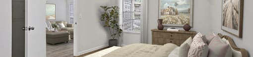 A bedroom with a bed, dresser, and painting on the wall.