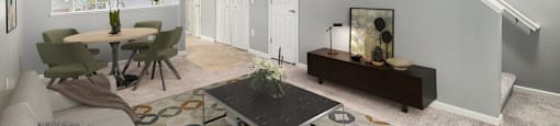 an open living room and dining room with a table and a couch