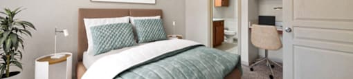 a bedroom with a bed and a ceiling fan