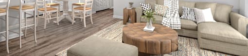 A living room with a dining table and chairs.