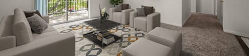 a living room with couches and a coffee table