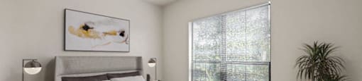 a bedroom with a bed and a ceiling fan