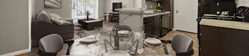 a living room and dining room with a glass table and chairs