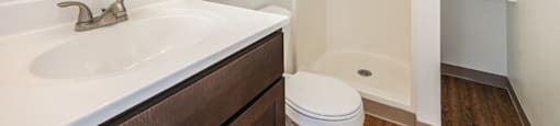 a bathroom with a sink toilet and shower