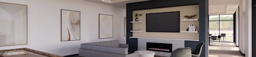 A modern living room with a shelving unit and a grey sofa.