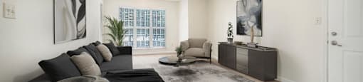 the living room of an apartment with a couch and a table
