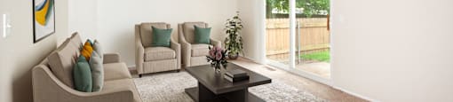 a living room with couches and chairs and a coffee table