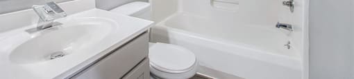 a bathroom with a sink toilet and bathtub