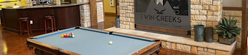 pool table in the clubhouse at twin creek apartments in durham, nc