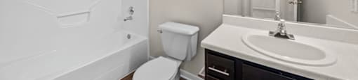 a bathroom with a sink toilet and bathtub