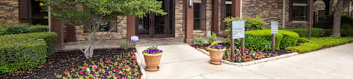 a home with a walkway in front of it