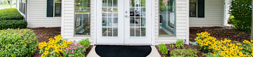 a white building with a black awning