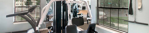 the gym at the enclave at woodbridge apartments in sugar land, tx