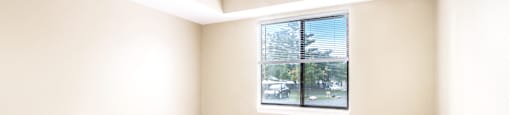 an empty room with a large window
