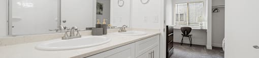 A bathroom with a vanity and a mirror.