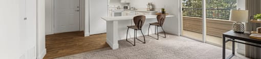 A white kitchen with a dining table and chairs.