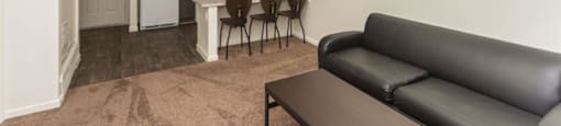 Living Room With Kitchen View at Highland Village Apartments, Flagstaff