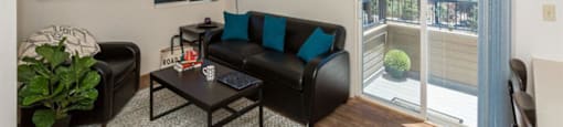 Living Room With Private Balcony at Highland Village Apartments, Flagstaff