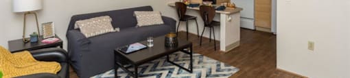 Modern Living Area With Kitchen View at Highland Village Apartments, Flagstaff, Arizona